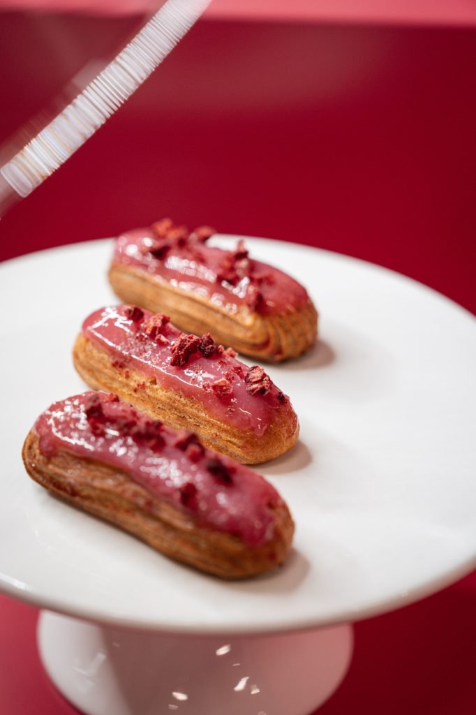 Pink éclairs served at the Miss Dior Café